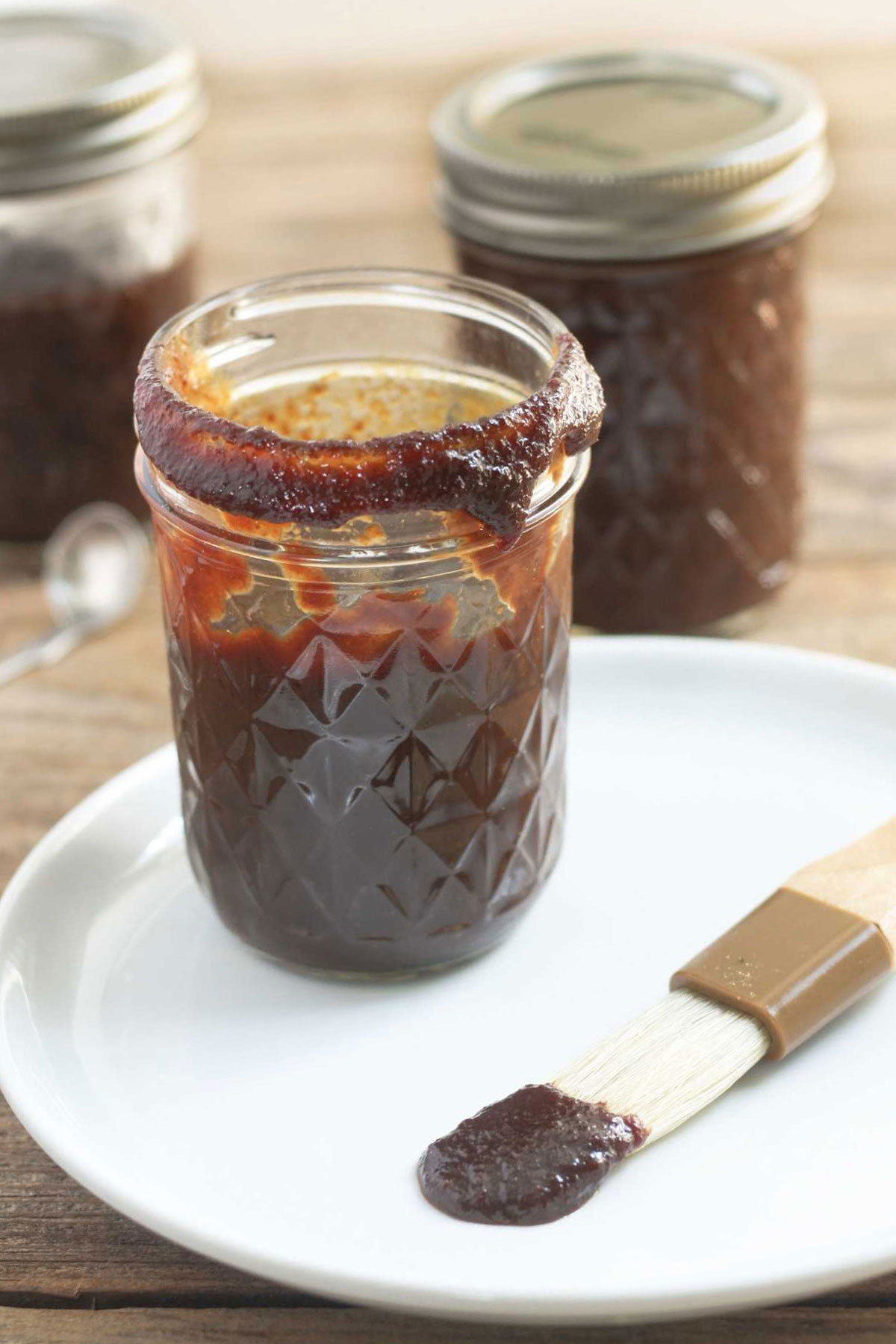 Cherry BBQ Sauce in canning jars with brush.