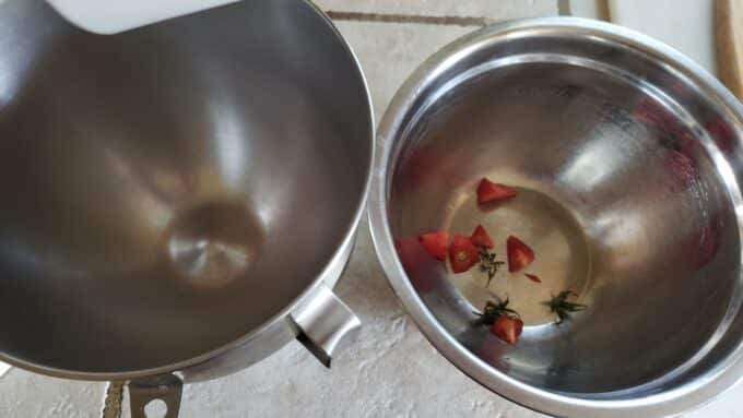 Bowls set up to catch juice and seeds.