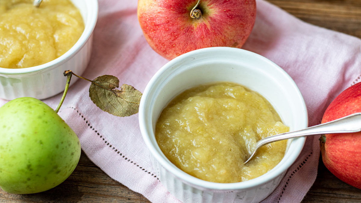 Close up of white bowl with applesauce.