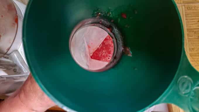 Canning funnel to assist loading juice into bags.