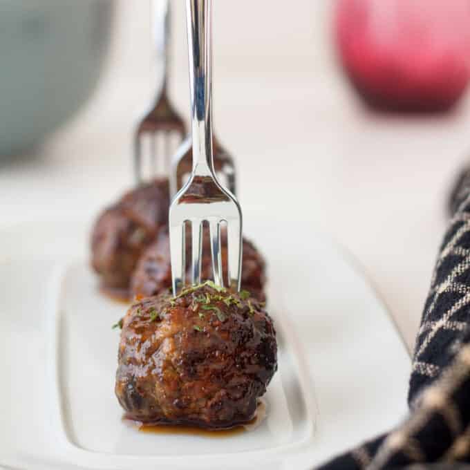 Meatballs with cocktail fork stuck in them.