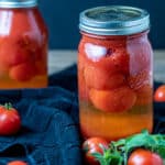 canned tomatoes in quart canning jar.