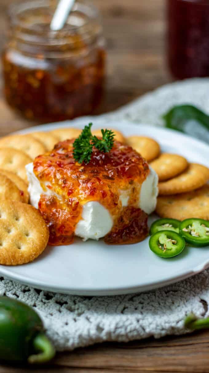Appetizer plate with cream cheese and jelly.
