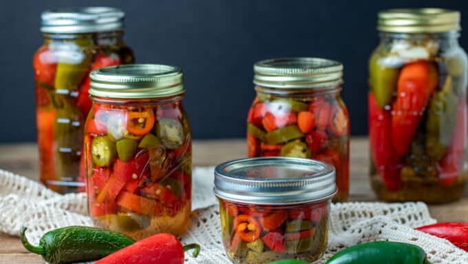 colorful  jars on barnwood board 