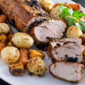 Sliced pork with roasted vegetables.