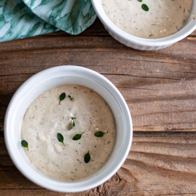 Two small bowls of horseradish sauce.