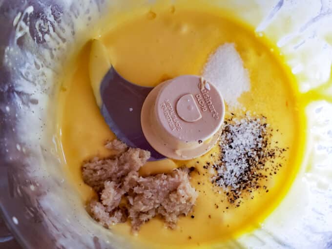 Aioli in food processor with additional ingredients added.