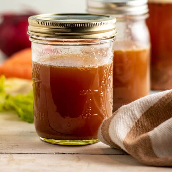 Clarified venison stock in jars