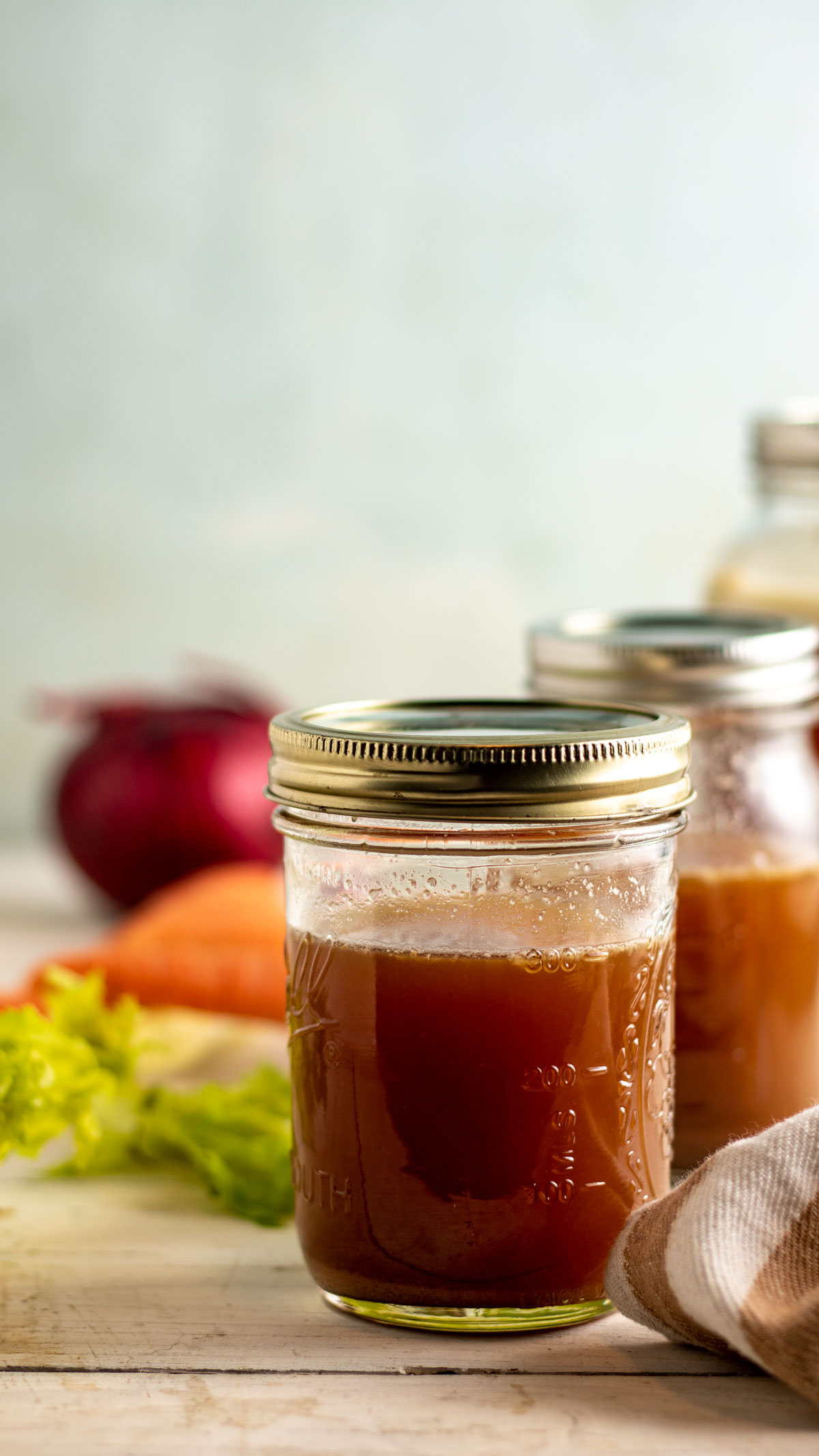Strained venison stock in jars.