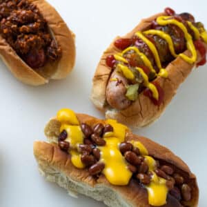 Air fried hot dogs with different toppings.
