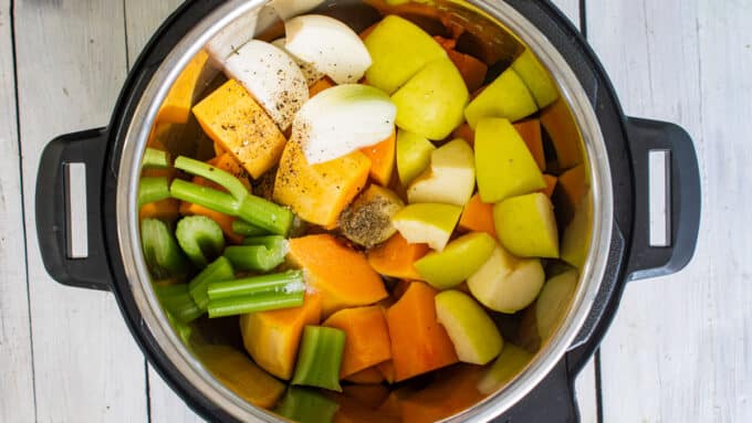 Instant pot filled with squash and veggies.