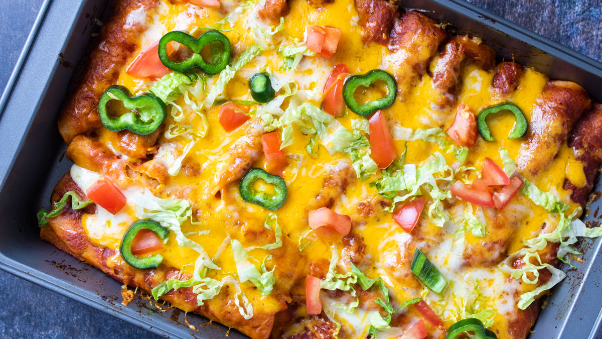 Over photo of tray filled with enchiladas.