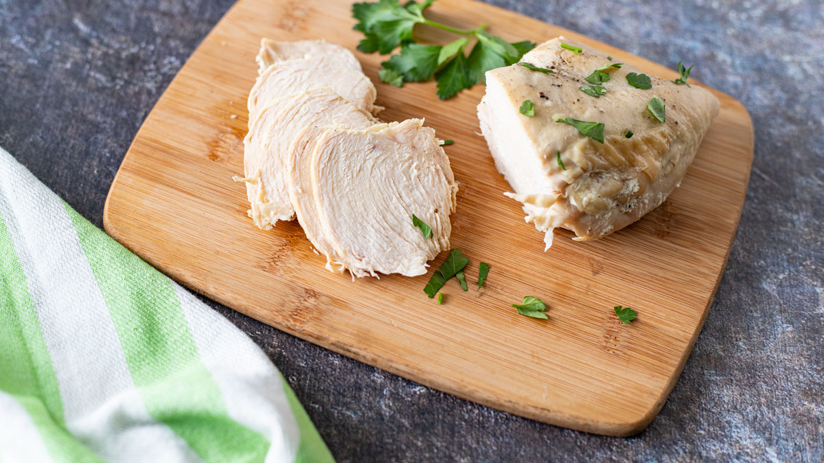 Slices of chicken with decorative towel.