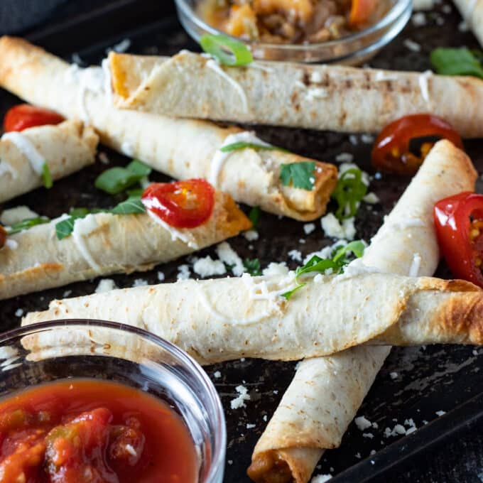 Close up of loaded taquitos.