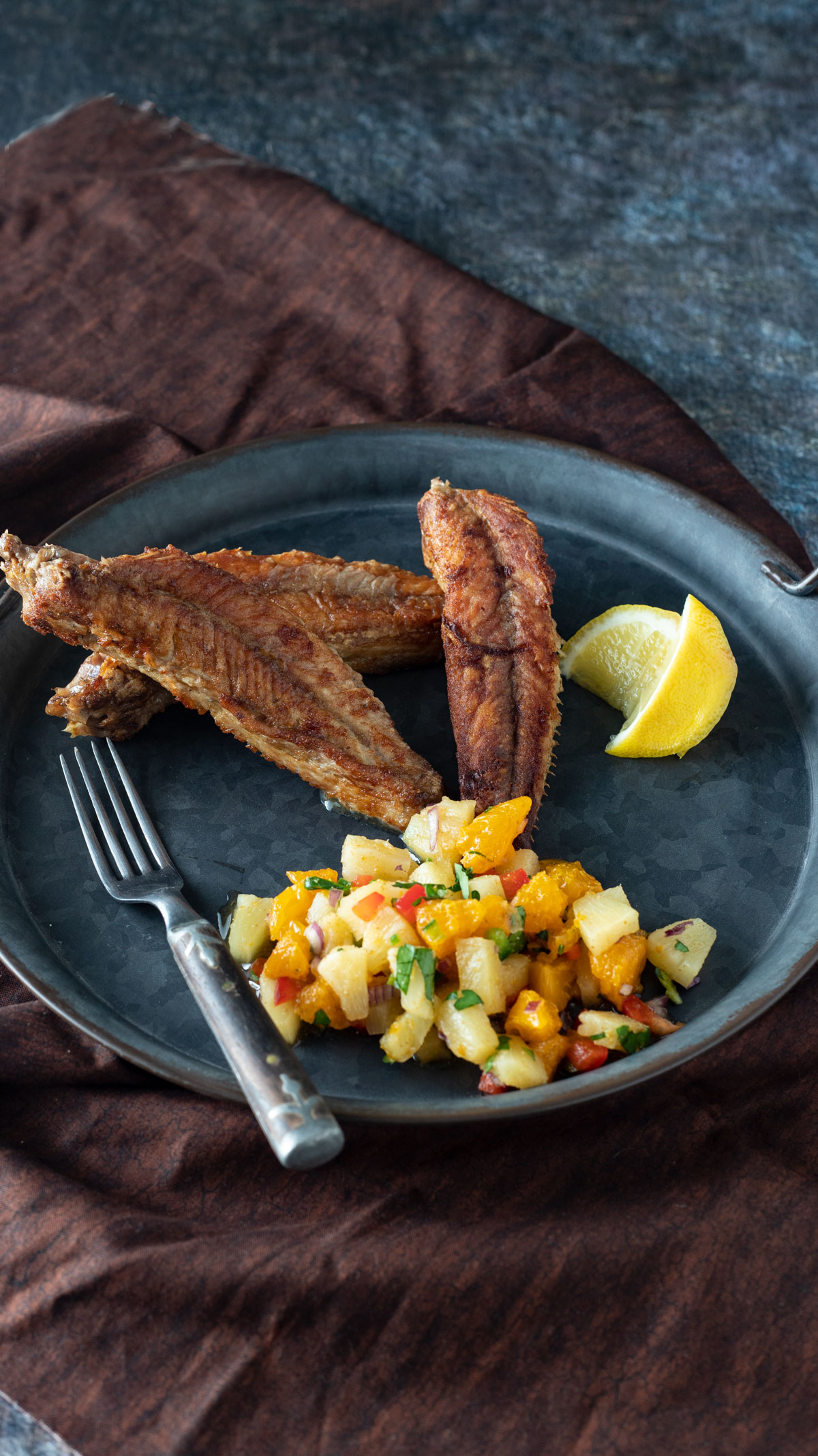 Bullhead filets on a pewter plate.