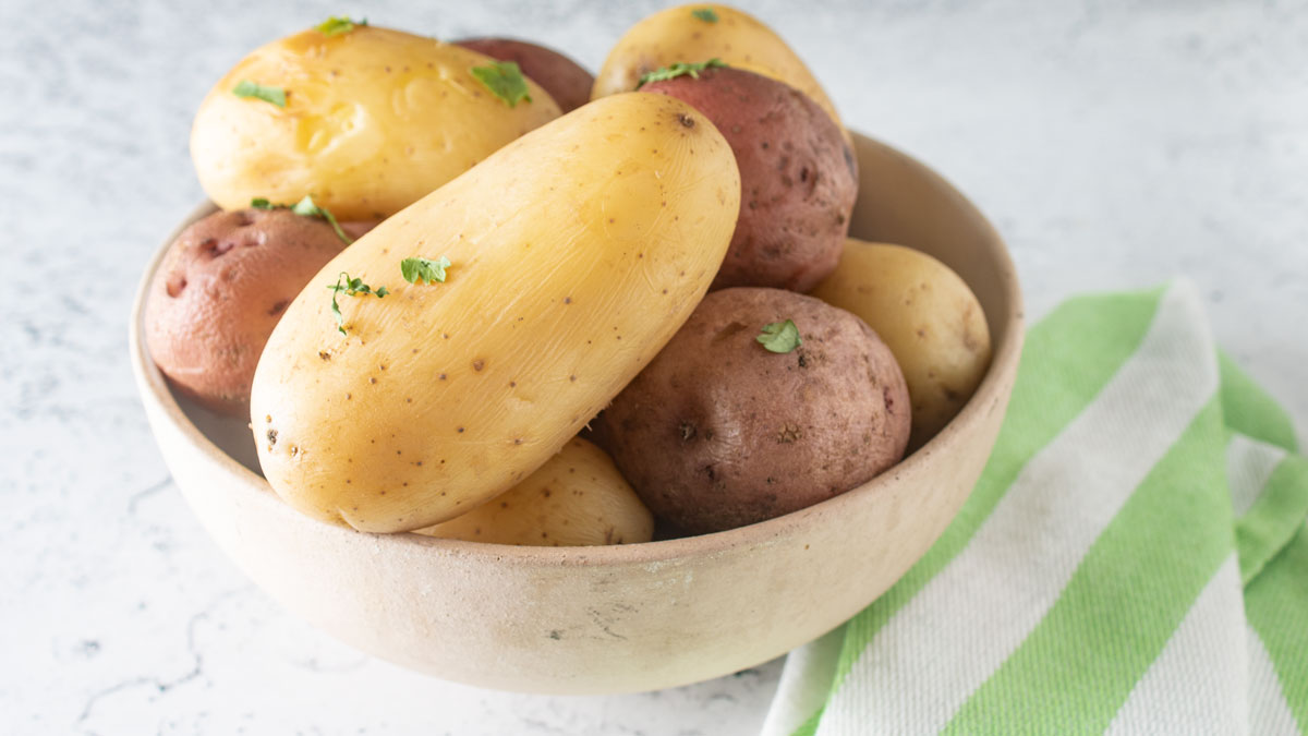Close up of bowl of colorful potatoes.