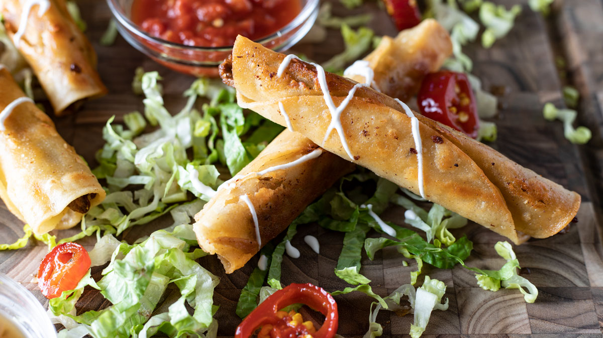 Platter with taquitos and fixings.