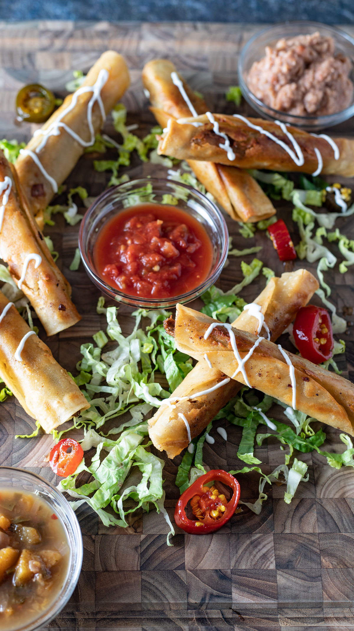Overhead photo of a platter of taquitos.