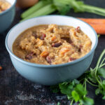 Blue bowl with yellow split pea soup.