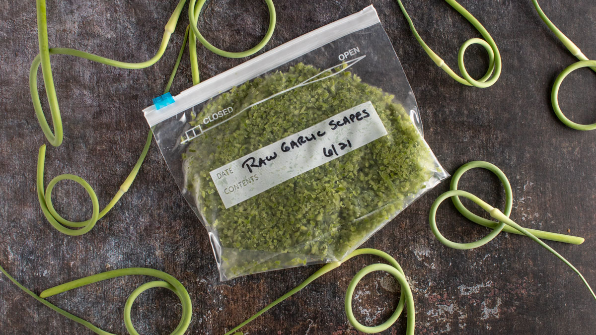 Raw garlic in freezer bag ready for freezing.