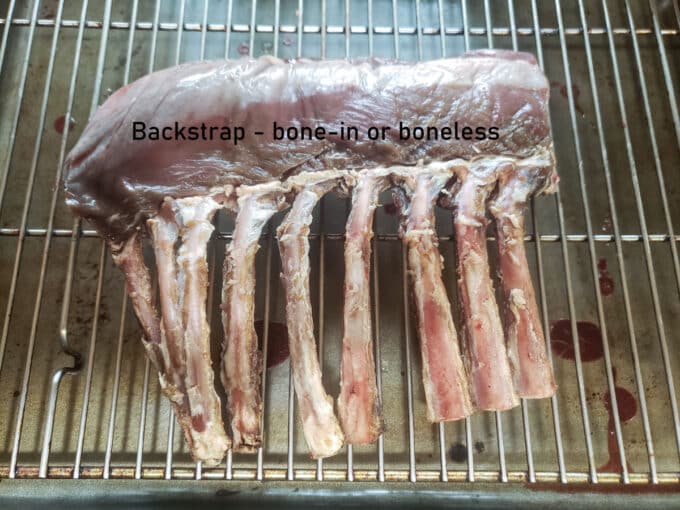 Bone in rack loin cut of venison on grates.