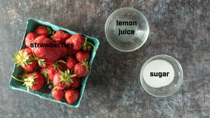 Ingredients for strawberry sauce. Strawberries, lemon juice, sugar.