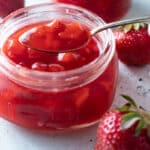 Close up of jar of Strawberry sauce.