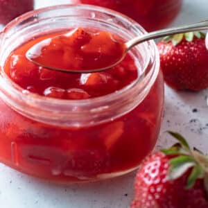 Close up of jar of Strawberry sauce.