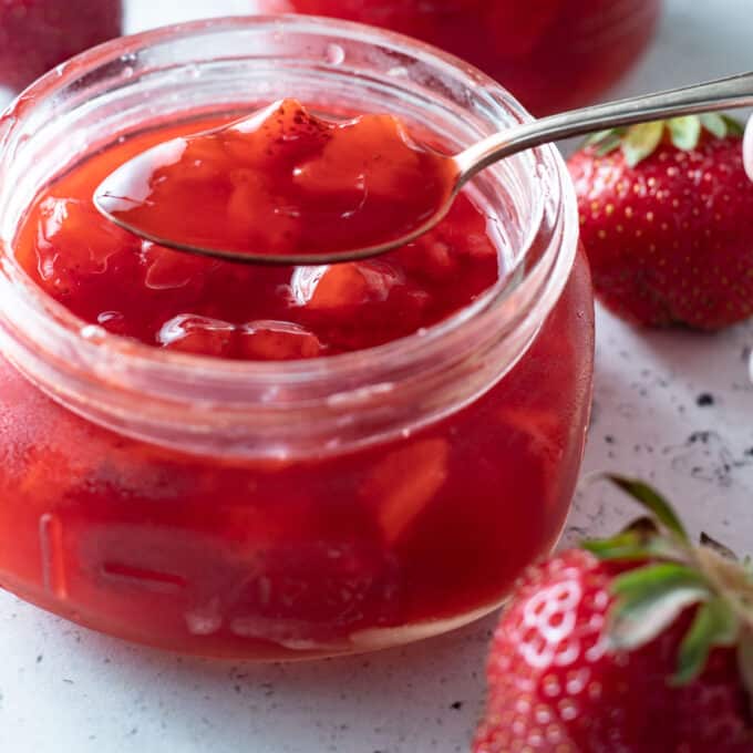 Close up of jar of Strawberry sauce.