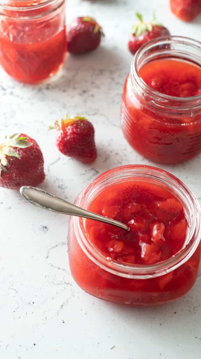 Spoon in jar of sauce.
