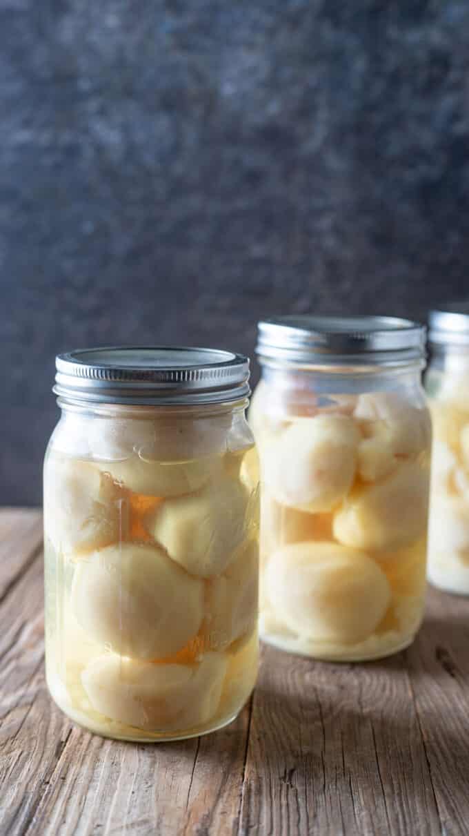 Line of jars of whole potatoes.