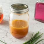 Chive vinaigrette in canning jar.