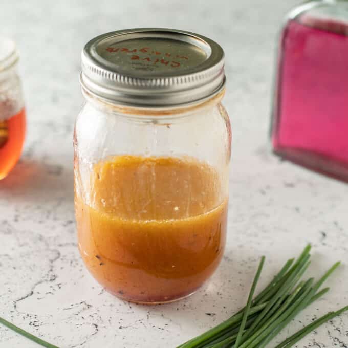 Chive vinaigrette in canning jar.