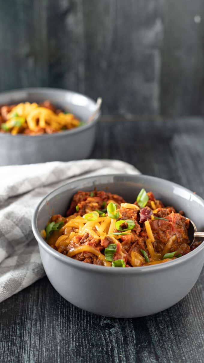 Bowls of chili in gray bowls.
