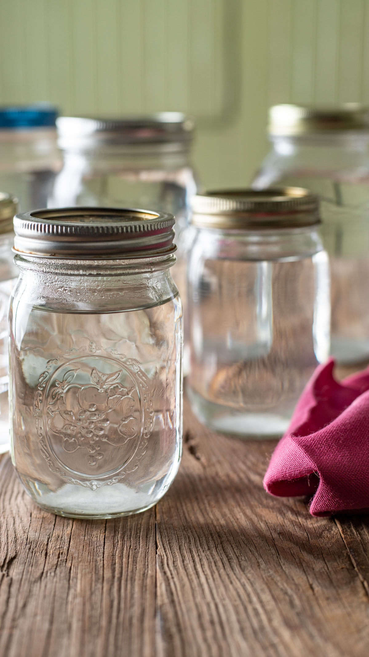 Pint and quart jars of canned water.