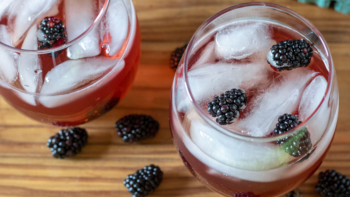 Overhead photo of glass of blackberry tea.