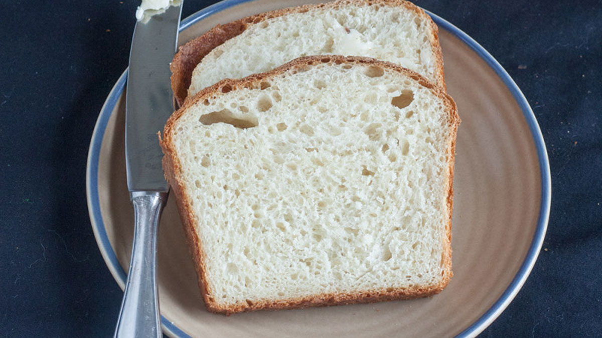 Slices of brioche with a butter knife.

