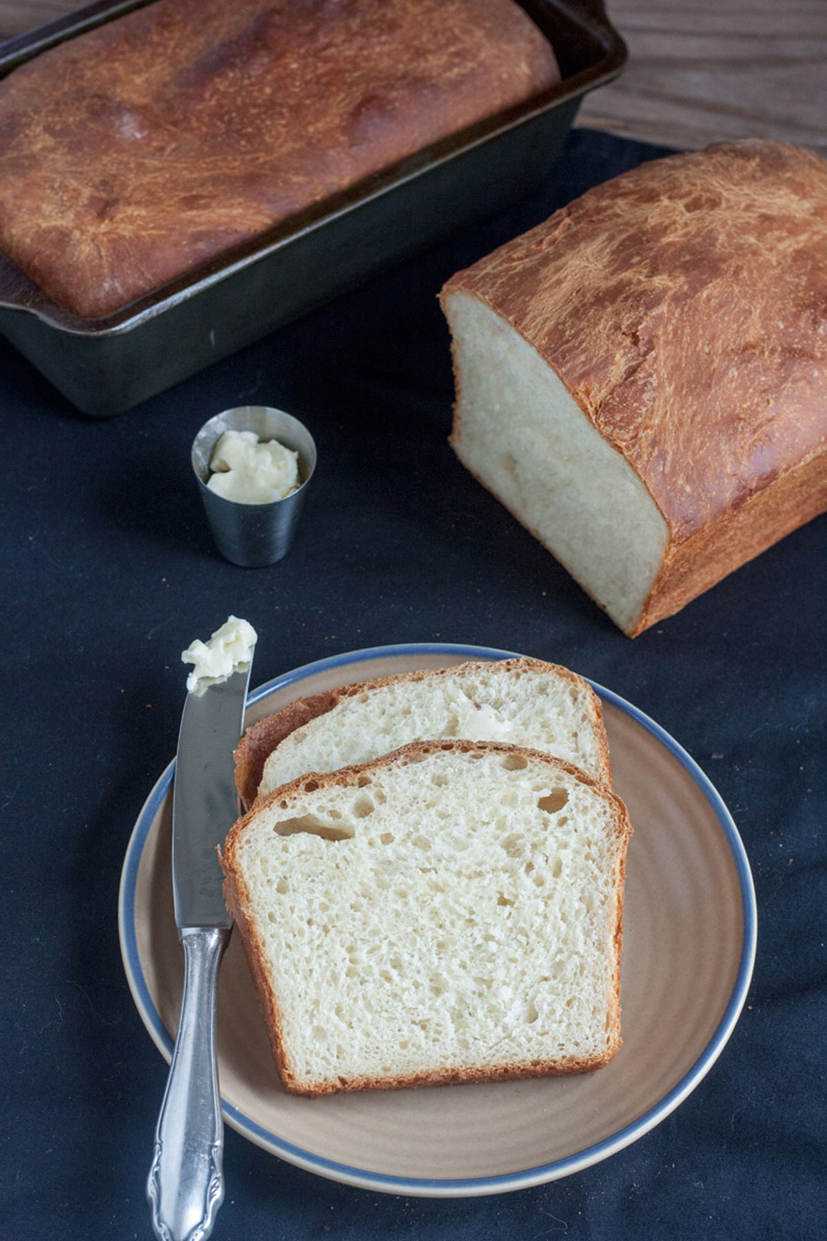 2 slices of white bread on beige plate.