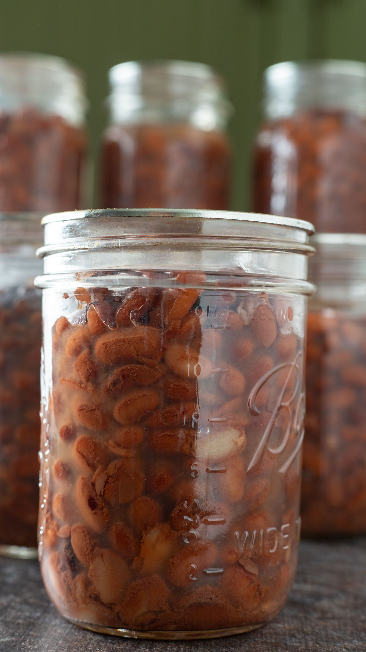 Close up photo of beans in jars.