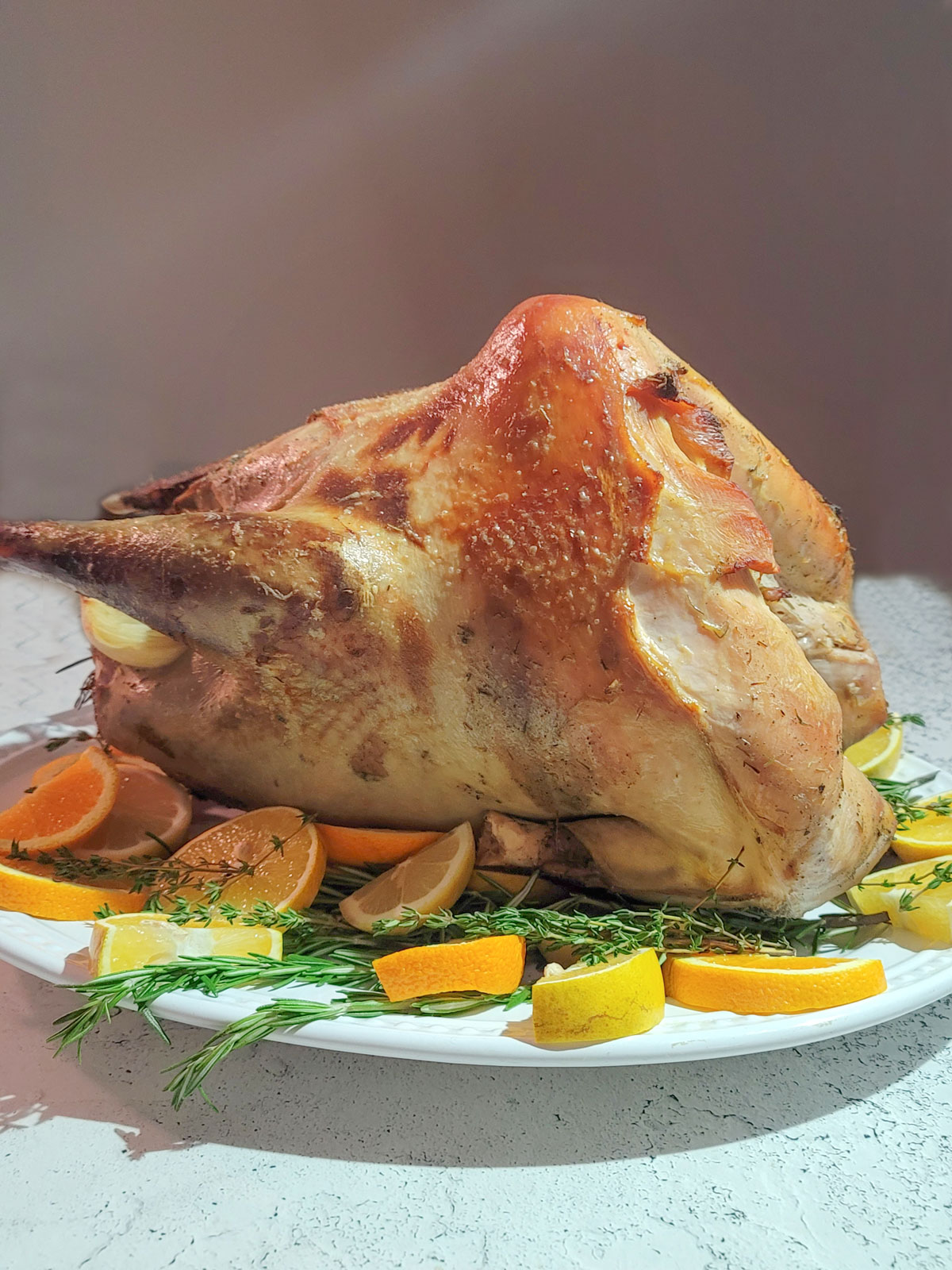 Wild turkey with oranges and fresh herbs.