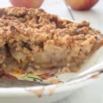 Sliced apple crumb pie side shot.