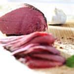 Slices of corned venison on board.