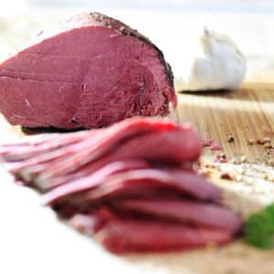 Slices of corned venison on board.