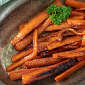Glazed carrots in vintage dish.