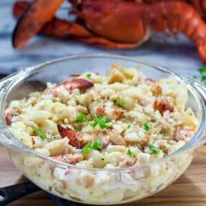 Lobster mac and cheese in a glass dish.