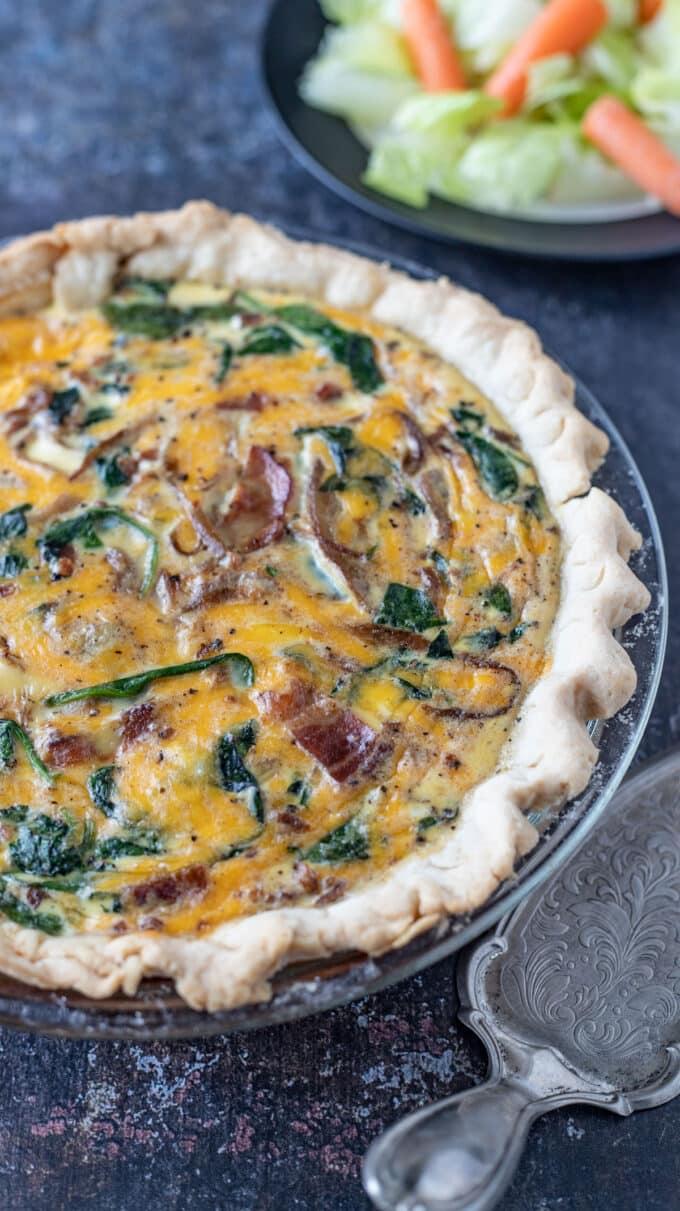 Whole quiche with salad.
