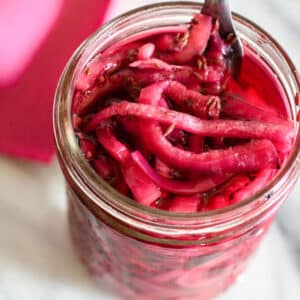 Open jar of pickled onions.