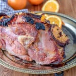 Cooked ham roast with pineapple slices.