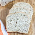Slices of rye bread on cutting board.