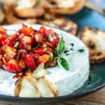 Melty brie topped with fresh strawberries and balsamic glaze.